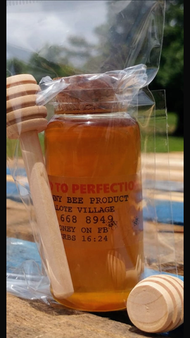 Honey with dipper